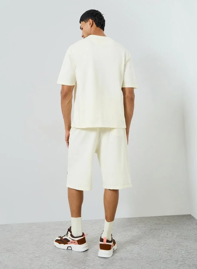 Styli  Men Cream Minimal Print Oversized T-Shirt and Shorts Co-Ords for Men | Best Price UAE